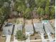 Aerial view of residential homes with green trees, fenced yards, and driveways at 2025 Lanneau Ln, Johns Island, SC 29455