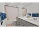 Bathroom with a double vanity, gray cabinets, a bathtub with shower, and a neutral color scheme at 2025 Lanneau Ln, Johns Island, SC 29455