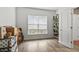 Bright, airy bedroom with lots of natural light and wood flooring at 2025 Lanneau Ln, Johns Island, SC 29455
