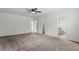 Spacious bedroom features neutral walls, soft carpet, and a ceiling fan at 2025 Lanneau Ln, Johns Island, SC 29455