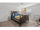 Bedroom featuring a wooden bed frame with blue bedding, a ceiling fan, and a window with blinds at 2025 Lanneau Ln, Johns Island, SC 29455