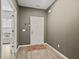 Inviting entryway with light wood floors and a white front door at 2025 Lanneau Ln, Johns Island, SC 29455