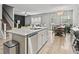 Open-concept kitchen featuring a granite island, stainless steel appliances, and adjacent dining area at 2025 Lanneau Ln, Johns Island, SC 29455
