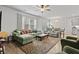 Cozy living room featuring plush seating, a ceiling fan, and lots of natural light at 2025 Lanneau Ln, Johns Island, SC 29455