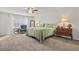 A well lit main bedroom featuring carpet, a ceiling fan, and neutral walls and decor at 2025 Lanneau Ln, Johns Island, SC 29455