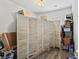 Storage room with light wood floors and a partial view of a folding screen and packed boxes at 2025 Lanneau Ln, Johns Island, SC 29455