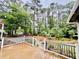Picture of a well-maintained backyard with a wooden deck and walkway at 204 Chamblee Rd, Walterboro, SC 29488