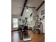 Bright bedroom with hardwood floors, ceiling fan, and exposed ceiling beams at 204 Chamblee Rd, Walterboro, SC 29488