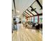 Bright living room boasts a vaulted ceiling with wooden beams, a fireplace, and a combination of seating at 204 Chamblee Rd, Walterboro, SC 29488