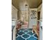 Spacious porch with a patterned blue rug and wooden furniture at 204 Chamblee Rd, Walterboro, SC 29488