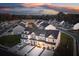 Aerial view of new construction townhomes featuring covered front porches and garages in a modern community at 207 Abercom Place Dr, Moncks Corner, SC 29461