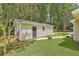 Backyard of home featuring an additional building and a grassy yard at 208 Kentucky Dr, Ladson, SC 29456