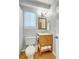 Bathroom featuring a wooden vanity, standard toilet, window, and a shower with a white curtain at 208 Kentucky Dr, Ladson, SC 29456