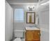 Bright bathroom featuring a vanity with a wooden mirror, a standard toilet, and a shower with a white curtain at 208 Kentucky Dr, Ladson, SC 29456