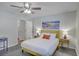Well-lit bedroom features neutral decor, furnishings, and tile flooring at 208 Kentucky Dr, Ladson, SC 29456