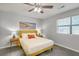 Well-lit bedroom features neutral decor and furnishings with tile flooring and ceiling fan at 208 Kentucky Dr, Ladson, SC 29456
