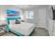 Well-lit bedroom featuring a queen bed with blue headboard and two nightstands under a window with blinds at 208 Kentucky Dr, Ladson, SC 29456