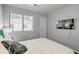 Bright bedroom featuring a queen bed with a blue headboard and a wall-mounted TV at 208 Kentucky Dr, Ladson, SC 29456