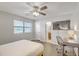 Bedroom featuring neutral decor, a ceiling fan and an adjacent bathroom and desk at 208 Kentucky Dr, Ladson, SC 29456