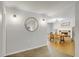 Open-concept dining area with wood floors and a decorative fireplace at 208 Kentucky Dr, Ladson, SC 29456