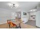 Open-concept dining area featuring modern lighting and flows into kitchen at 208 Kentucky Dr, Ladson, SC 29456