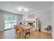 Bright dining room featuring a modern light fixture and sliding glass doors at 208 Kentucky Dr, Ladson, SC 29456