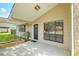 Inviting covered front entrance featuring a black door with glass and decorative windows at 208 Kentucky Dr, Ladson, SC 29456