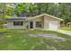 Charming single-story home with an attached garage and well-maintained lawn at 208 Kentucky Dr, Ladson, SC 29456