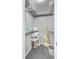 Walk-in closet featuring shelving and ample space for storage, with gray tiled flooring and white trim at 208 Kentucky Dr, Ladson, SC 29456