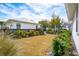 A well-maintained backyard features lush landscaping and a charming white house in the background at 2123 Boatwright Rd, Johns Island, SC 29455
