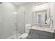 Bathroom featuring glass shower, granite countertop and a framed mirror at 2123 Boatwright Rd, Johns Island, SC 29455