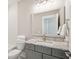 Bathroom featuring white subway tile, granite countertop, framed mirror and tub at 2123 Boatwright Rd, Johns Island, SC 29455