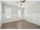 Cozy bedroom with hardwood floors and white wainscoting at 2123 Boatwright Rd, Johns Island, SC 29455