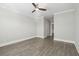 This bedroom has light gray walls, a ceiling fan, wood-look floors, and base moulding at 2123 Boatwright Rd, Johns Island, SC 29455