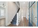 Welcoming foyer with a staircase, hardwood floors, and a blue front door at 2123 Boatwright Rd, Johns Island, SC 29455