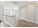 Upstairs hallway with hardwood floors, natural light, and white railings at 2123 Boatwright Rd, Johns Island, SC 29455