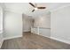 Hallway with hardwood floors and view of the stairs with white wood railing at 2123 Boatwright Rd, Johns Island, SC 29455