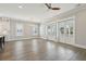 Spacious living room with hardwood floors and natural light from the doors and windows at 2123 Boatwright Rd, Johns Island, SC 29455