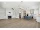 Bright and airy living room and kitchen combination with a fireplace and stainless steel appliances at 2123 Boatwright Rd, Johns Island, SC 29455