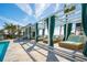 Elegant poolside lounging area with stylish cabanas, offering a relaxing and luxurious retreat at 2123 Boatwright Rd, Johns Island, SC 29455