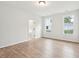 Bright bedroom with wood floors, large windows, and ensuite bathroom access at 2181 Blue Bayou Blvd, Johns Island, SC 29455