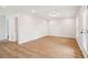 Spacious bonus room with wood floors and a door to the outside at 2181 Blue Bayou Blvd, Johns Island, SC 29455
