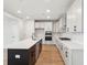 A modern kitchen offers an eat-in island, modern appliances, and ample storage space at 2181 Blue Bayou Blvd, Johns Island, SC 29455