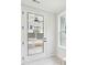 A mud room features a white door with a large window and tiled floors at 2181 Blue Bayou Blvd, Johns Island, SC 29455