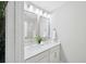 Bright bathroom featuring double sink vanity, framed mirrors, and modern lighting fixtures at 221 Abercom Place Dr, Moncks Corner, SC 29461