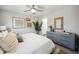 Bedroom with a large bed, ceiling fan, dresser, art and plants at 221 Abercom Place Dr, Moncks Corner, SC 29461