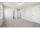 Spacious bedroom with neutral carpet, three entry doors, and fresh paint at 221 Abercom Place Dr, Moncks Corner, SC 29461