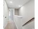 Upstairs hallway featuring carpet, white walls, and interior doors at 221 Abercom Place Dr, Moncks Corner, SC 29461