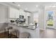 Kitchen featuring granite countertops, a breakfast bar, and white cabinetry at 221 Abercom Place Dr, Moncks Corner, SC 29461