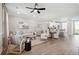 Open-concept living room with hardwood floors and lots of natural light at 221 Abercom Place Dr, Moncks Corner, SC 29461